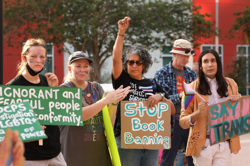 Orlando, Florida-April 11, 2023-Students, teachers, parents, and other concerned citizens hold a rally after the Orange County school board meeting in Orlando, Florida on April 11, 2023, to voice their opposition to the move by the school boards and the Florida legislature to remove books from school library shelves and limit education on race and LGBTQ issues. (Carolyn Cole / Los Angeles Times)