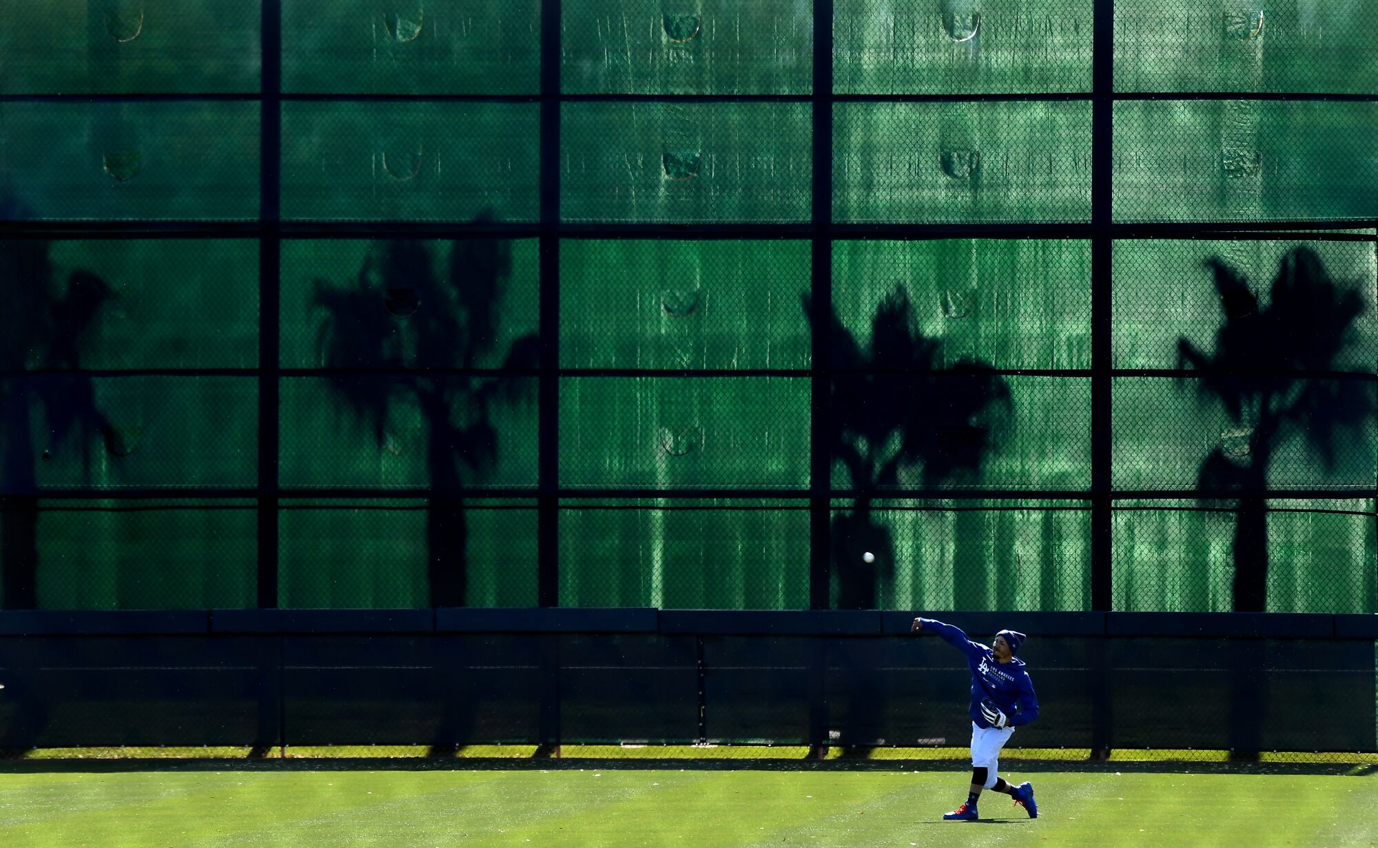 Dodgers outfielder Mookie Betts throws in the outfield 