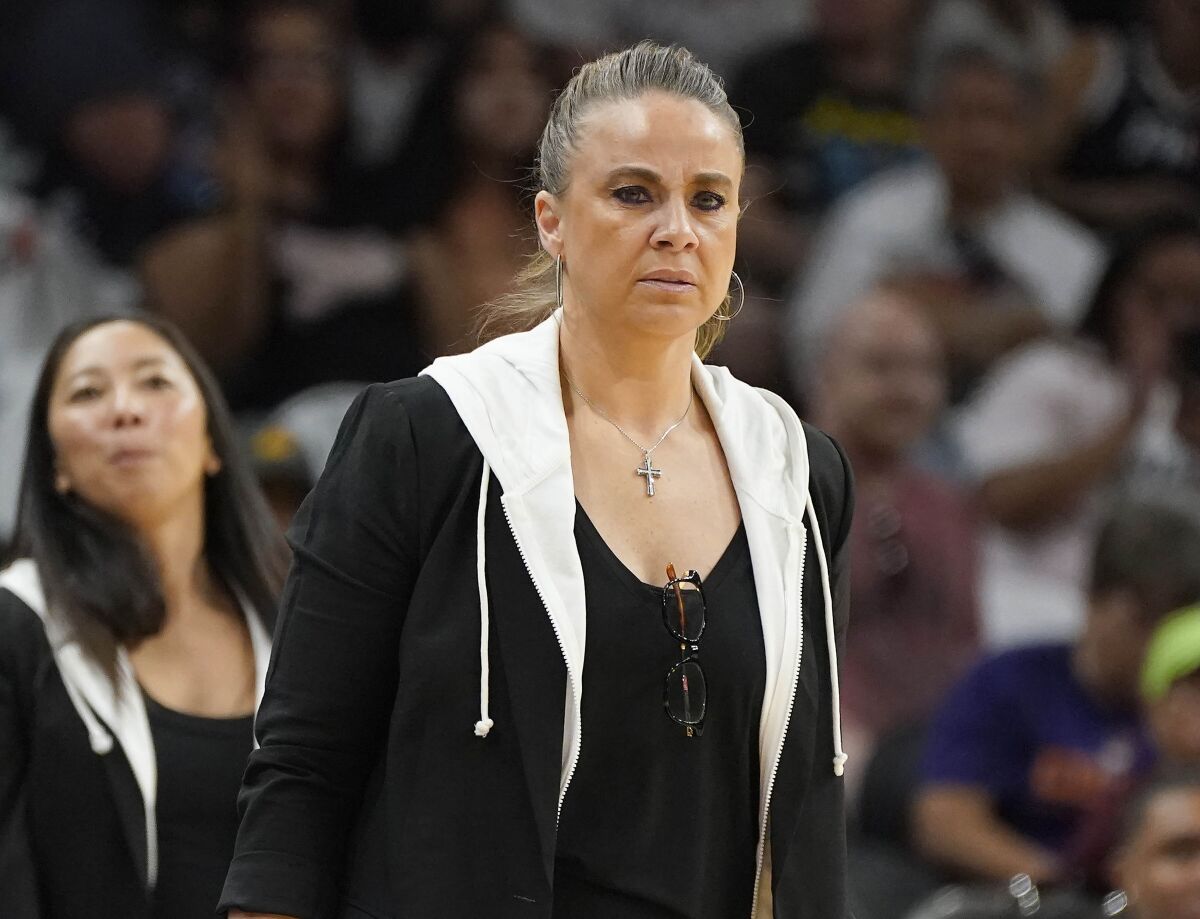 Las Vegas Aces new head coach Becky Hammon keeps an eye on her team during the first half of a WNBA basketball game against the Phoenix Mercury Friday, May 6, 2022, in Phoenix. (AP Photo/Darryl Webb)