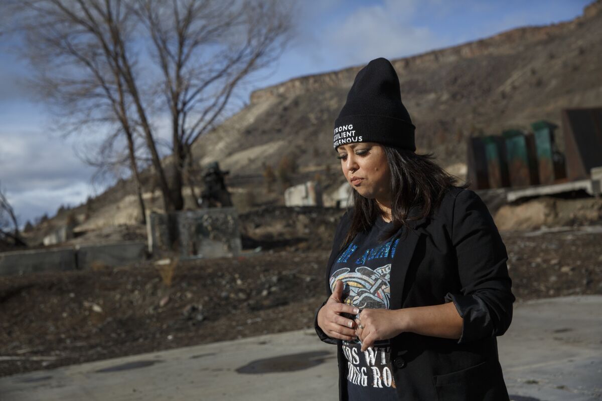 Carina Miller, a tribal council member, stands where Warm Springs Forest Products Industries was located. The lumber mill closed in 2016.