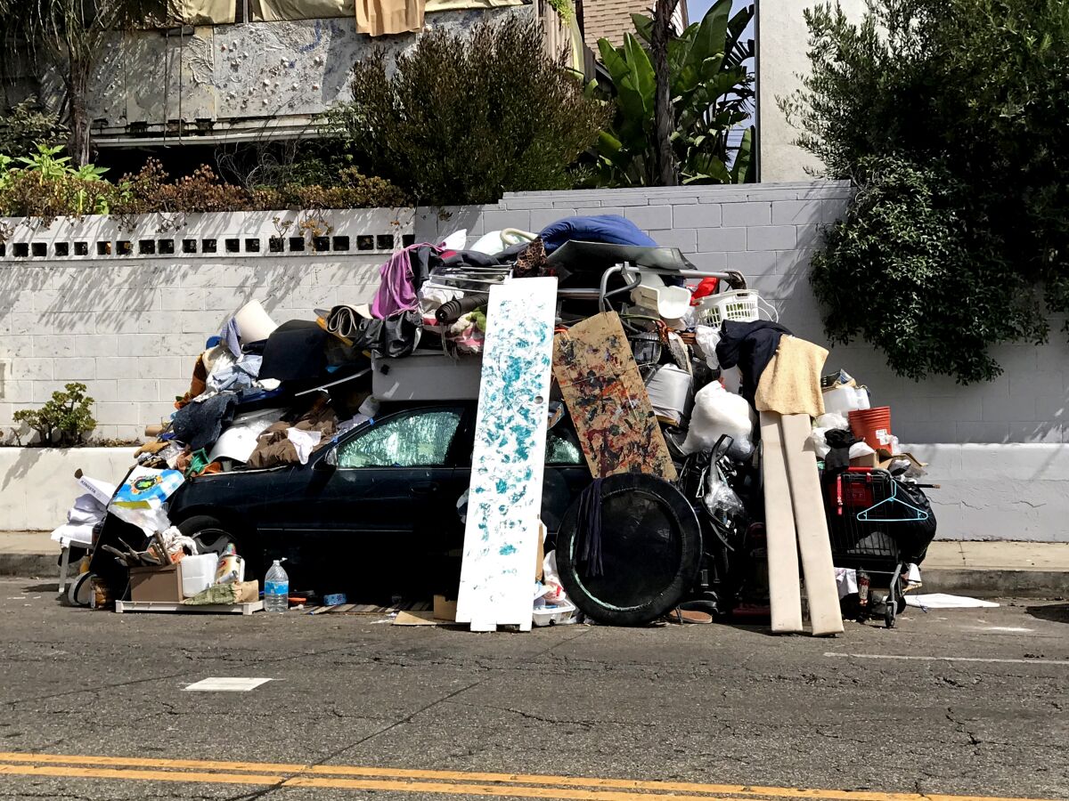 A car is heaped with belongings on Pacific Avenue in Venice.