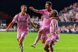 Inter Miami's Lionel Messi (10) celebrates with teammates DeAndre Yedlin (2) and Christopher McVey.