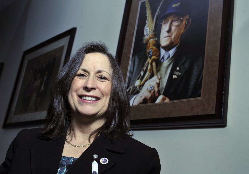 FILE - Marilynn "Lynn" Malerba stands next to a photograph of late Chief Ralph Sturges at Tribal offices in Uncasville, Conn., on March 4, 2010. Malerba, who is Native American, was nominated to be U.S. Treasurer in a historic first, Tuesday, June 21, 2022. Biden's nomination of Malerba to the federal Treasury role was announced ahead of Treasury Secretary Janet Yellen’s visit to the Rosebud Indian Reservation in South Dakota, Tuesday. (AP Photo/Jessica Hill, File)