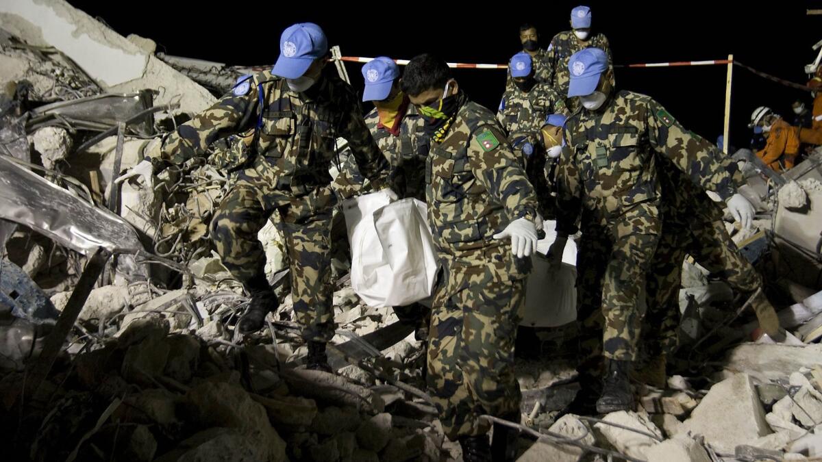 Nepalese peacekeepers from the United Nations Stabilization Mission in Haiti, MINUSTAH, help in the recovery process following the January 2010 earthquake that devastated the country.