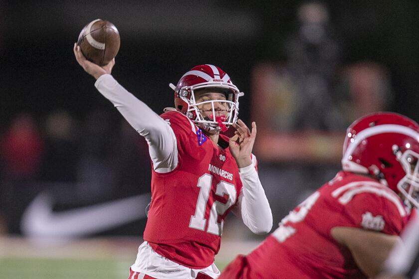 Mission Viejo, CA - December 11: Mater Dei quarterback Elijah Brown throws the ball against San Mateo Serra in the second quarter of the "2021 CIF State Football Championship Bowl Games - Open Division" tournament in Saddleback College, Mission Viejo, CA on Saturday, Dec. 11, 2021. (Allen J. Schaben / Los Angeles Times)