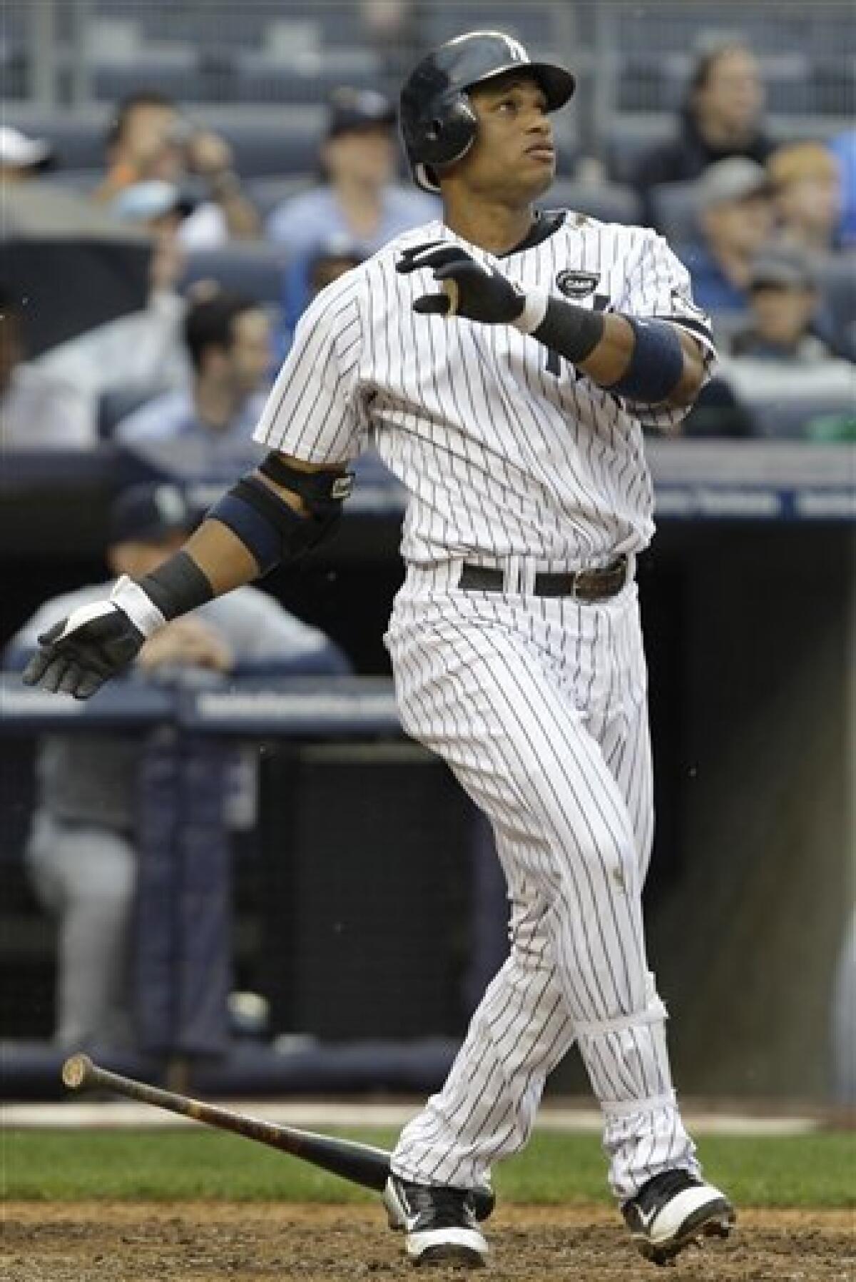 Photo: New York Yankees Robinson Cano runs the bases after hitting