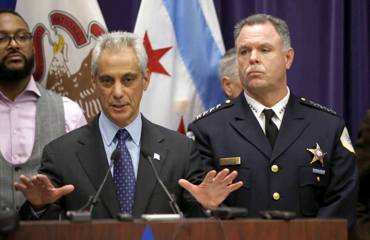Chicago Mayor Rahm Emanuel and then-Police Superintendent Garry McCarthy appear at a news conference in Chicago on Nov. 24, 2015, announcing first-degree murder charges against Officer Jason Van Dyke in the death of Laquan McDonald.