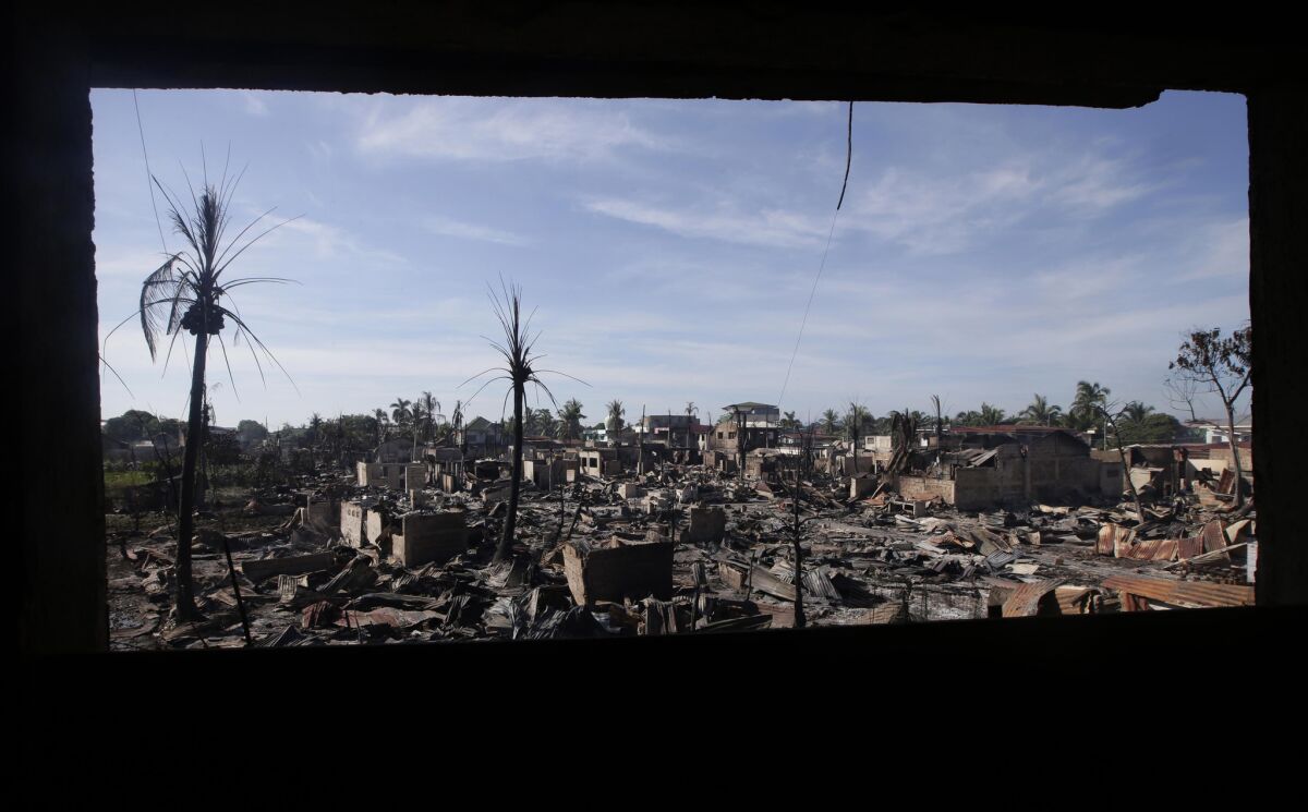Gutted houses are seen in Zamboanga on Friday, a day after fierce fighting between Philippine government troops and Muslim rebels.