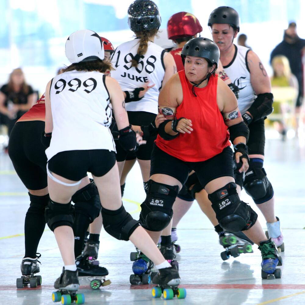 Two roller derby teams compete