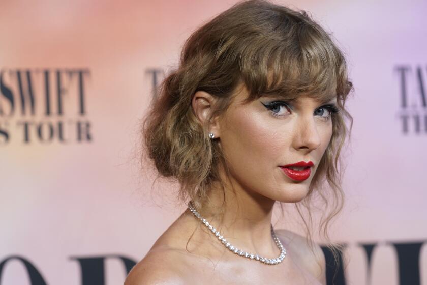 Taylor Swift arrives at the world premiere of the concert film "Taylor Swift: The Eras Tour" on Wednesday, Oct. 11, 2023, at AMC The Grove 14 in Los Angeles. (AP Photo/Chris Pizzello)