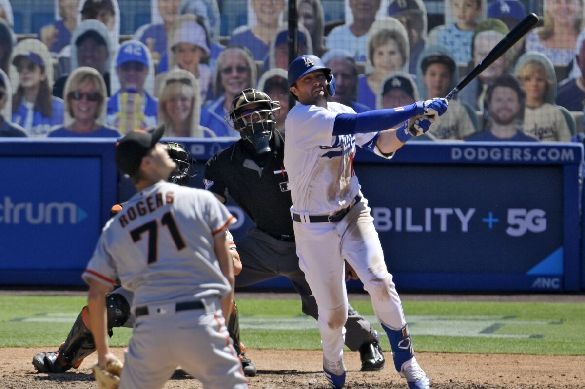 Dodgers designated hitter AJ Pollock hits a three-run home run off San Francisco Giants relief pitcher Tyler Rogers.