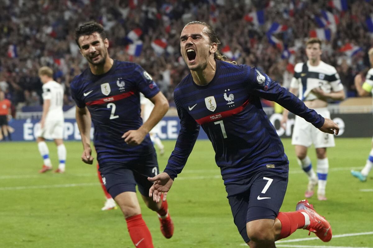 France's Antoine Griezman celebrates after scoring his side's first goal during the World Cup 2022 group D qualifying soccer match between France and Finland at Decines stadium in Lyon, France, Tuesday Sept. 7, 2021. (AP Photo/Laurent Cirpiani)
