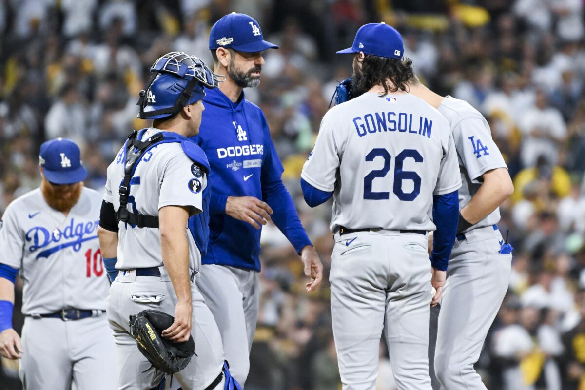 Dodgers pitching coach Mark Prior speaks with Tony Gonsolin during a first-inning mound visit Friday.