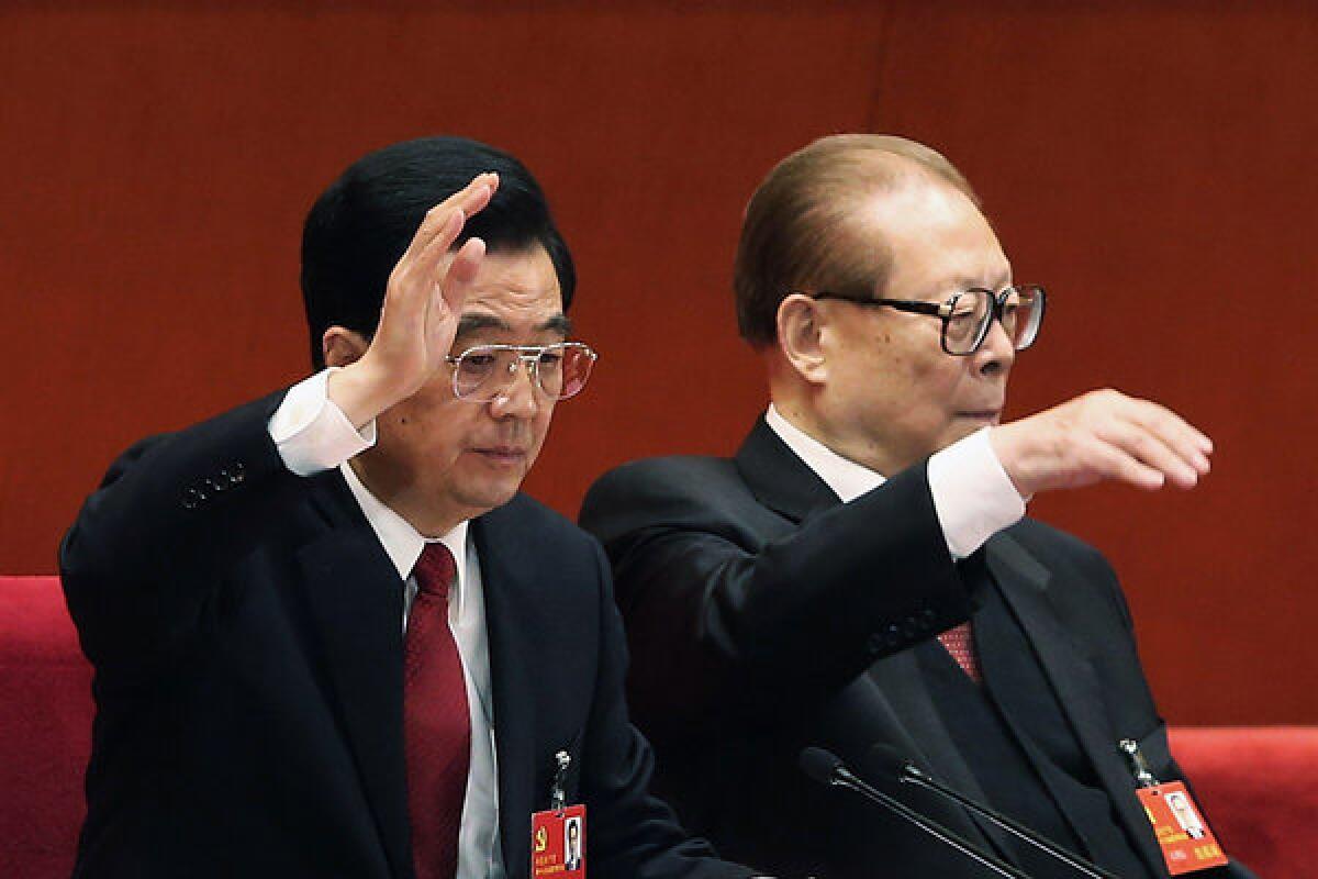 Chinese President Hu Jintao, left, and former President Jiang Zemin vote Wednesday at the closing of the 18th Communist Party Congress at the Great Hall of the People in Beijing.