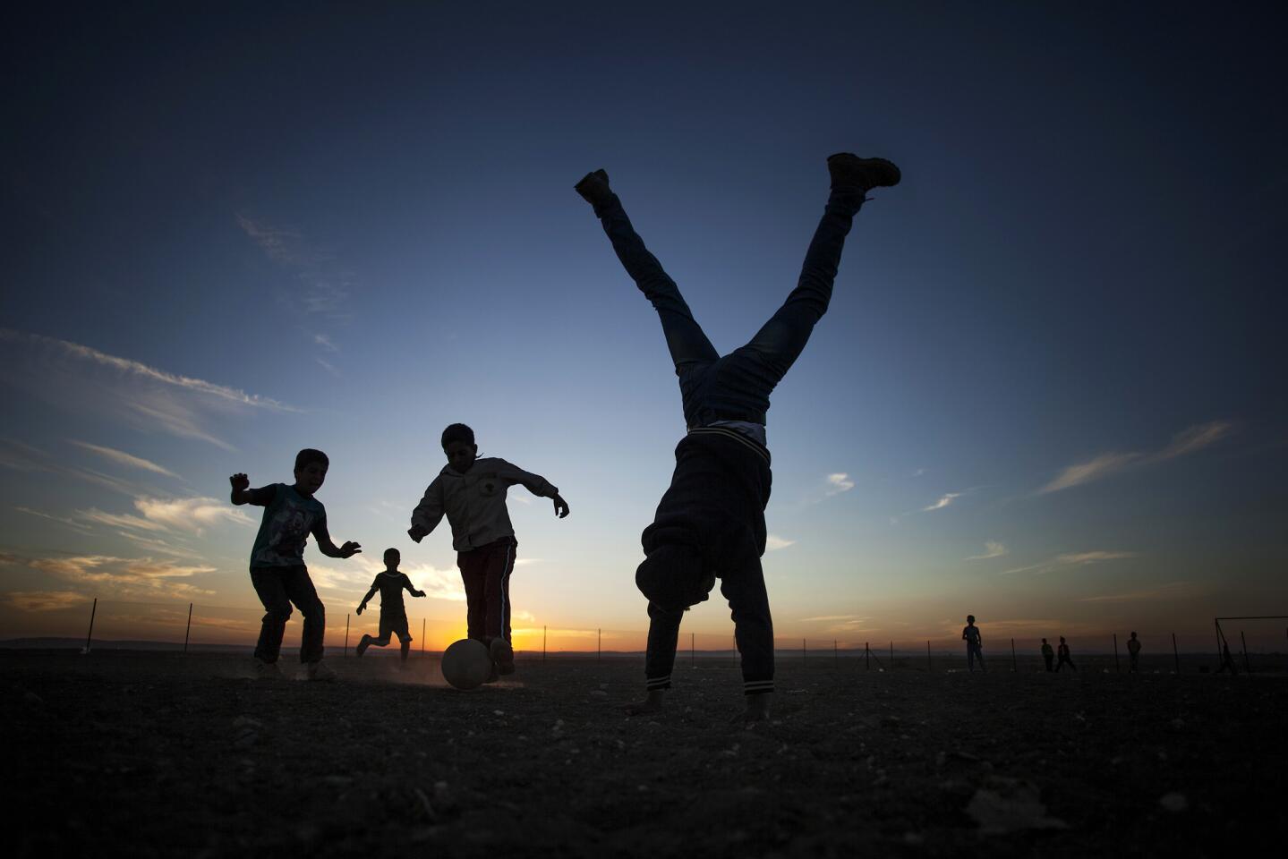 Syrian refugees play soccer