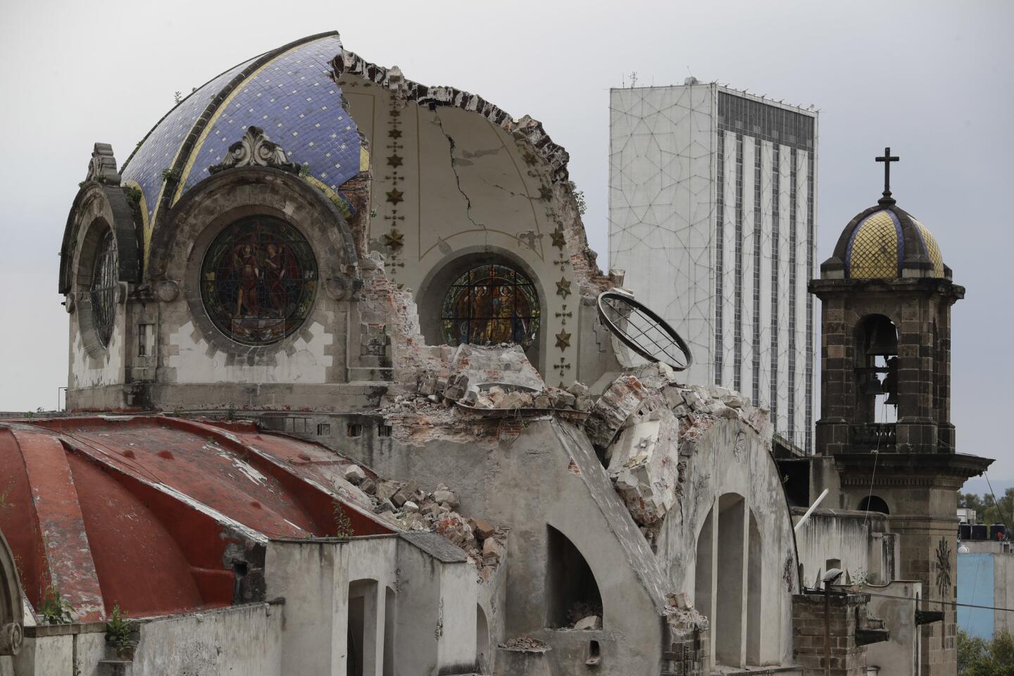 The damaged dome of Our Lady of Angels Church, which collapsed Sunday afternoon, is seen from an adjacent rooftop in the Guerrero neighborhood of Mexico City.