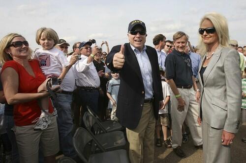 Republican presidential candidate Sen. John McCain, accompanied by his wife Cindy, right, greets the crowd at Wings over Meridian Air Show in Mississippi.