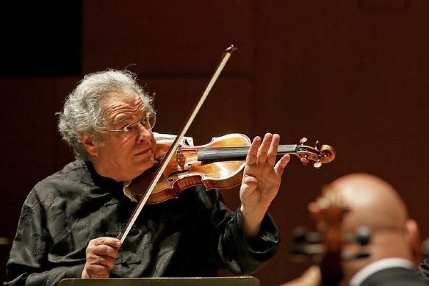 Itzkhak Perlman does double duty as he plays the violin and conducts the L.A. Phil in three programs.