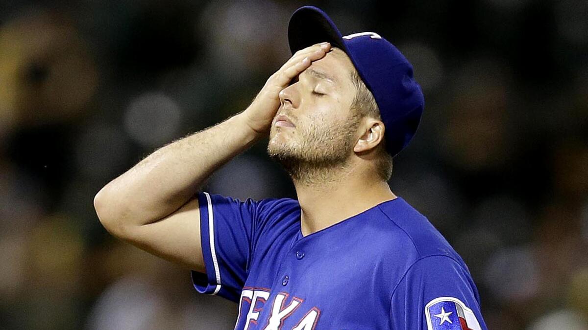 Rangers relief pitcher Shawn Tolleson blew his fourth save of the season when giving up a grand slam to Oakland's Khris Davis with two out in the ninth inning Tuesday night.