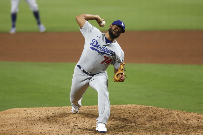 Dodgers player Kenley Jansen throws a pitch from the mound.