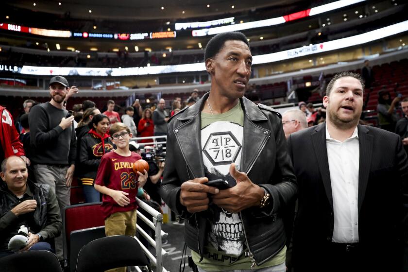 Former Bulls player Scottie Pippen walks to the court before a game against the Cavaliers at the United Center on Dec. 4, 2017.