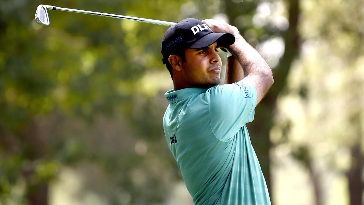 Shubhankar Sharma plays his shot from the eighth tee during the second round of the World Golf Championship in Mexico City on Friday.
