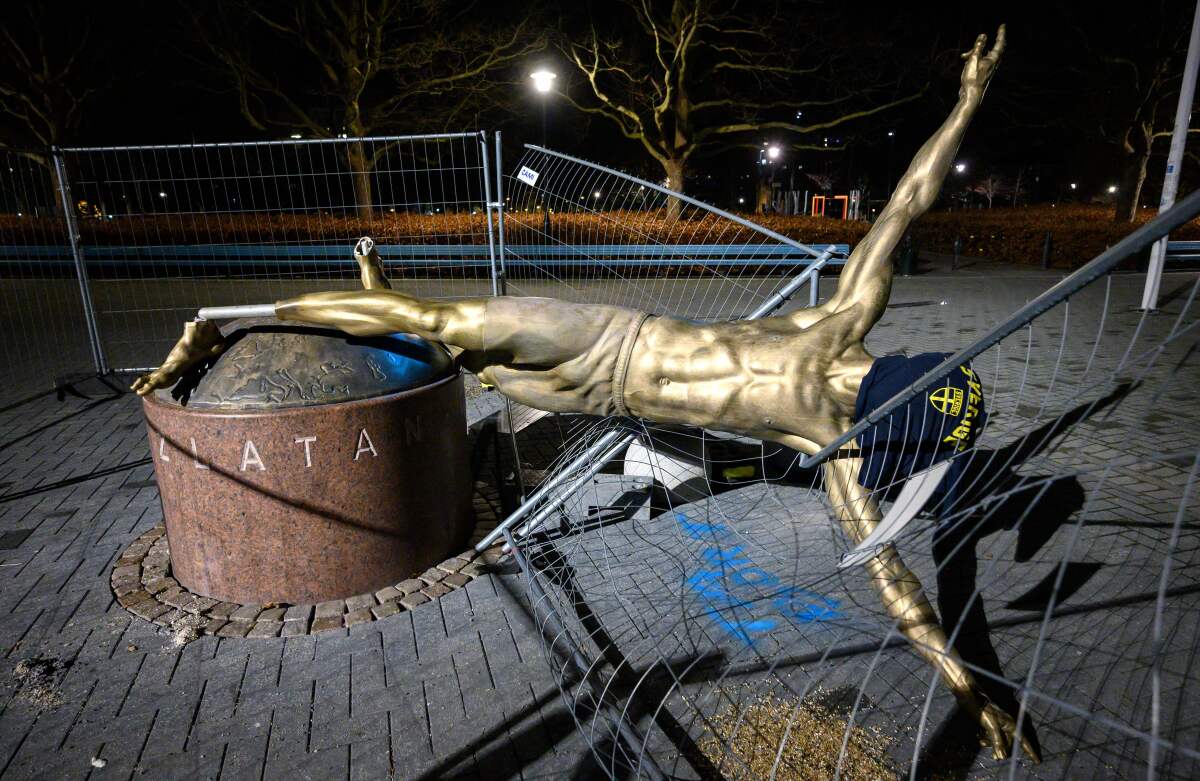The statue of former Galaxy star Zlatan Ibrahimovic lies toppled in Malmo, Sweden, after being vandalized Saturday night.