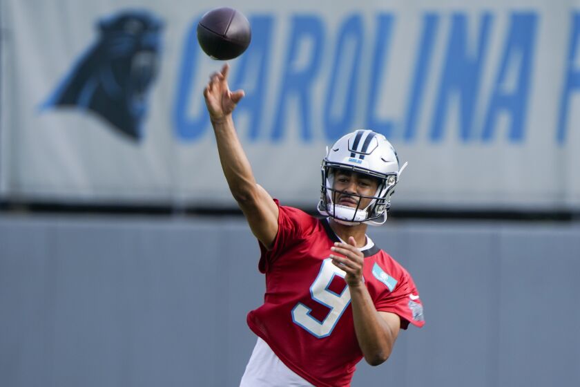 Carolina Panthers quarterback Bryce Young (9) throws a pass during NFL football practice, Thursday, June 1, 2023, in Charlotte, N.C. (AP Photo/Erik Verduzco)