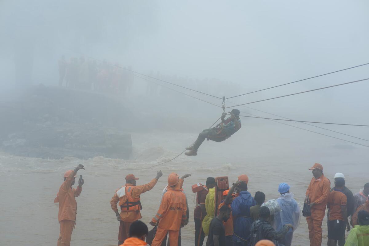 Rescuers try to reach affected people.
