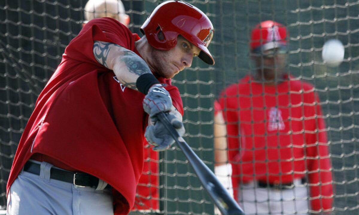 Angels outfielder Josh Hamilton takes part in batting practice on Thursday. Hamilton says his calf injury will not prevent him from playing in the team's season opener.