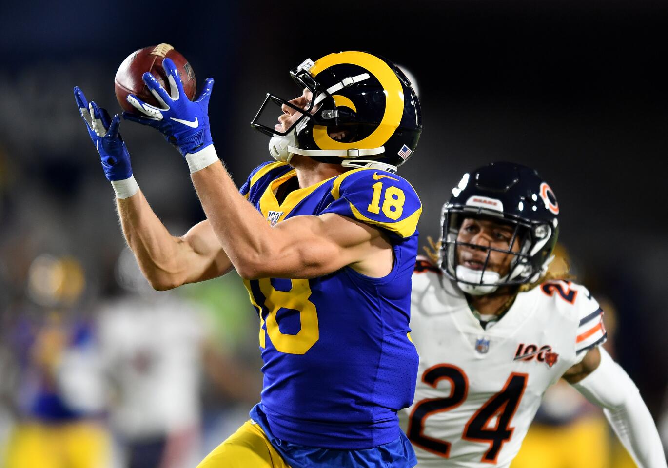 LOS ANGELES, NOVEMBER 17, 2019-Rams receiver Cooper Kupp cacthes a long pass in front of Bears defensive back Buster Skrine setting up a touchdown in the 2nd quarter at the Coliseum Sunday. (Wally Skalij/Los Angerles Times)