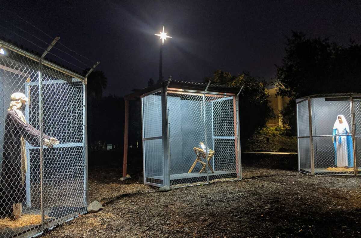 A nativity scene at Claremont United Methodist Church depicts the Holy Family separated as refugees in cages.