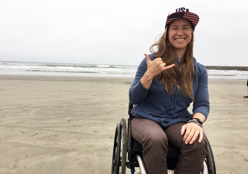 Adaptive surfer Sarah Bettencourt, 35, of Rancho Penasquitos at USA Surfing’s 2019 Adaptive Surfing Championship Thursday at Oceanside Harbor’s North Jetty beach.