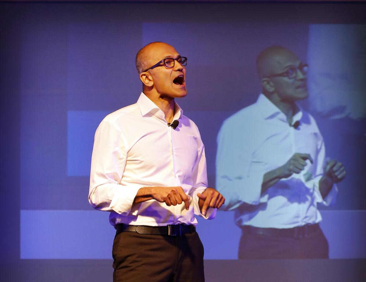Microsoft Chief Executive Satya Nadella's statement that women shouldn't ask for raises echoed throughout the tech industry and beyond on Thursday. He is pictured in late September speaking to students in New Delhi.