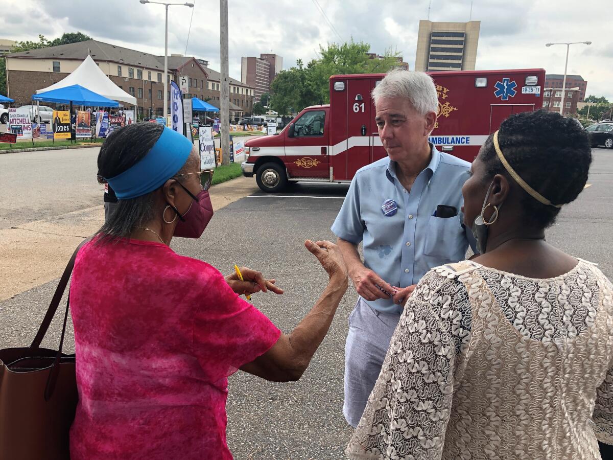 FILE - Steve Mulroy, a candidate for district attorney in Shelby County, Tenn., speaks with voters outside a polling location on July 30, 2022, in Memphis, Tenn. Mulroy defeated Shelby County District Attorney Amy Weirich in Thursday’s Aug. 4 election, after a contentious race that featured clashes over abortion prosecutions as well as a new state law requiring strict sentencing for violent crimes and other issues. (AP Photo/Adrian Sainz, File)