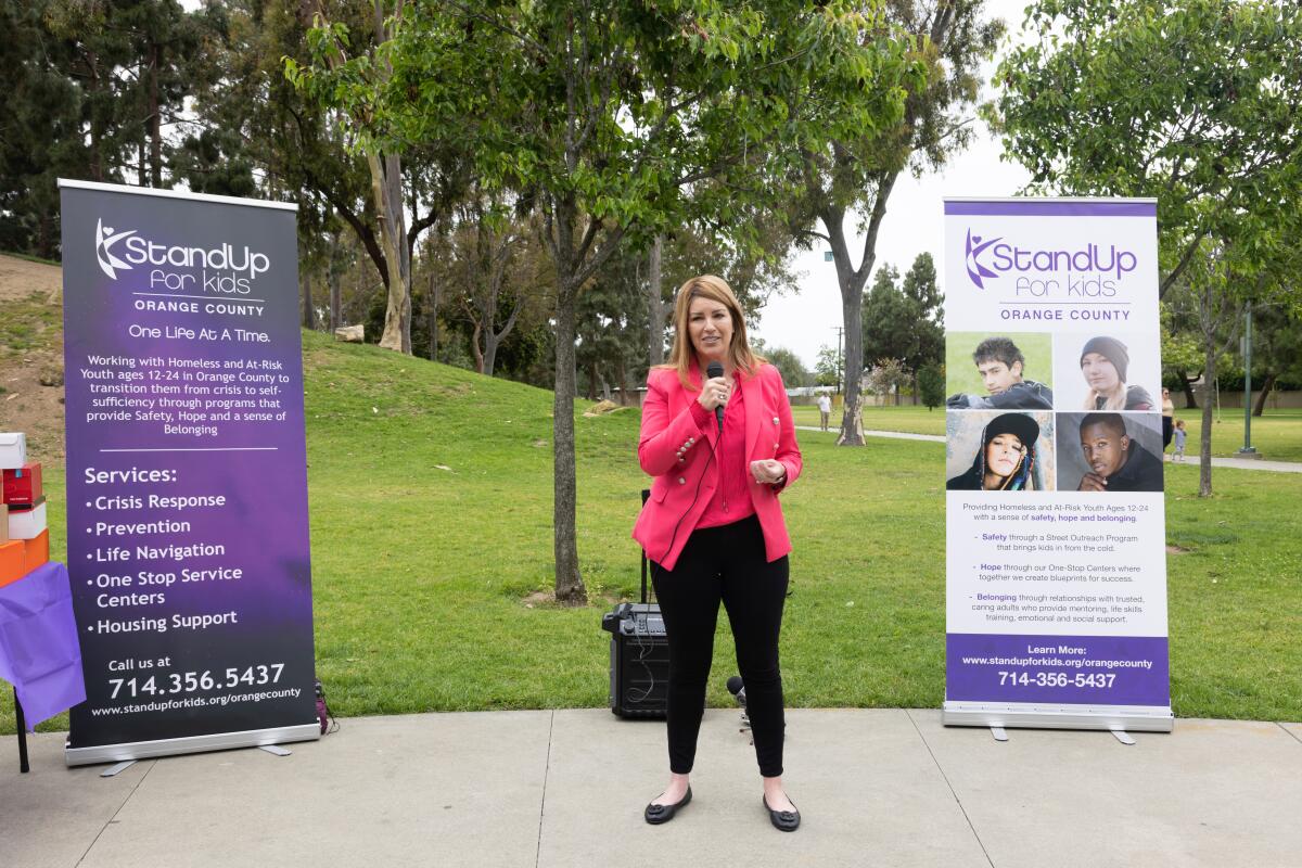 UnitedHealthcare of Southern California CEO Tami Adams speaks to youth served by StandUp for Kids at TeWinkle Park Thursday.