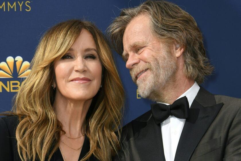 (FILES) In this file photo taken on September 17, 2018 Lead actor in a comedy series nominee William H. Macy and his wife actress Felicity Huffman arrive for the 70th Emmy Awards at the Microsoft Theatre in Los Angeles. - Two Hollywood actresses including Oscar-nominated "Desperate Housewives" star Felicity Huffman are among 50 people indicted in a nationwide university admissions scam, court records unsealed in Boston on March 12, 2019 showed. The accused, who also include chief executives, allegedly cheated to get their children into elite schools, including Yale, Stanford, Georgetown and the University of Southern California, federal prosecutors said.Huffman, 56, and Lori Loughlin, 54, who starred in "Full House," are charged with conspiracy to commit mail fraud and honest services mail fraud. A federal judge set bond at $250,000 for Felicity Huffman after she was charged in a massive college admissions cheating scandal. (Photo by VALERIE MACON / AFP)VALERIE MACON/AFP/Getty Images ** OUTS - ELSENT, FPG, CM - OUTS * NM, PH, VA if sourced by CT, LA or MoD **