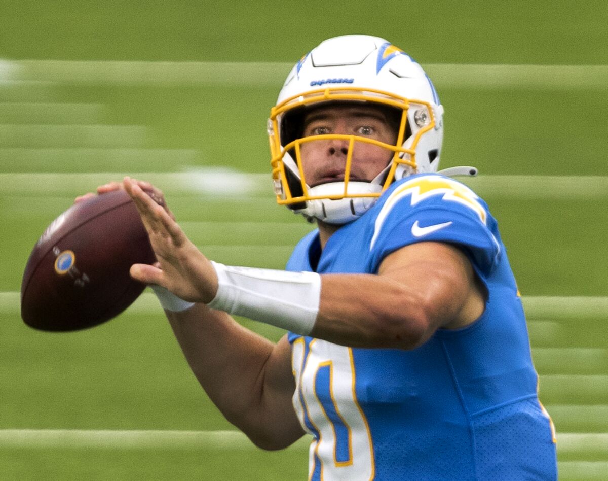 Chargers quarterback Justin Herbert looks for a receiver against the Jacksonville Jaguars