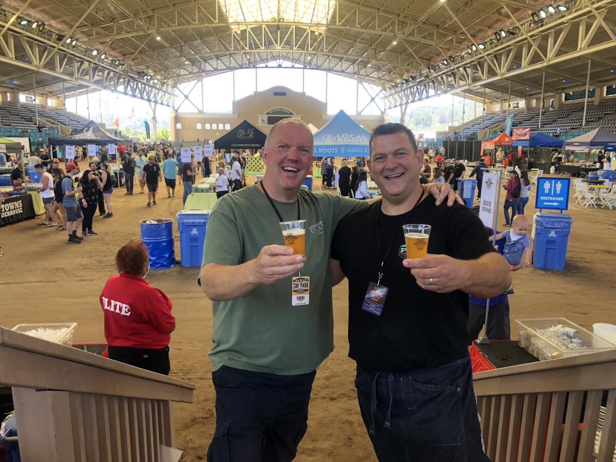 Tom Nickel, left, and business partner Tyson Blake at the San Diego International Beer Festival.