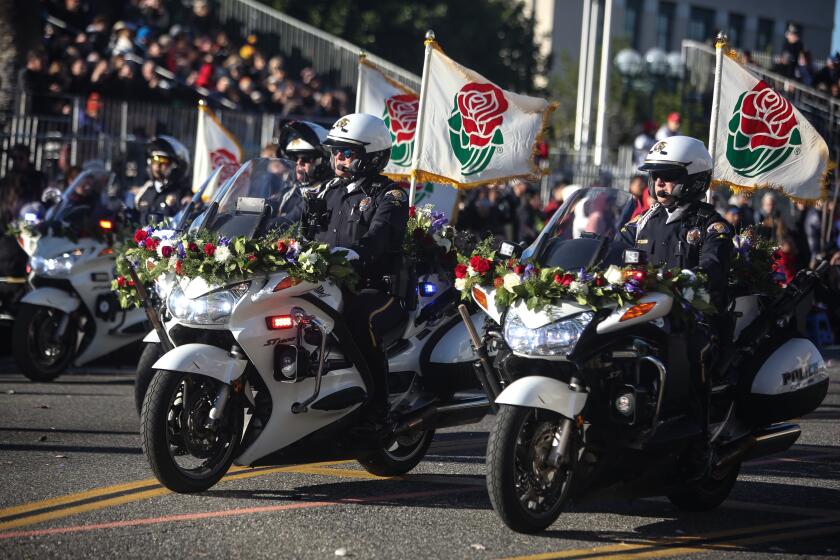 Pasadena CA., January 1, 2020: Pasadena Police Department clear the roads at the start 2020 Rose Bowl Parade route on Wednesday, January 1, 2020 in Pasadena, California. (Jason Armond / Los Angeles Times)