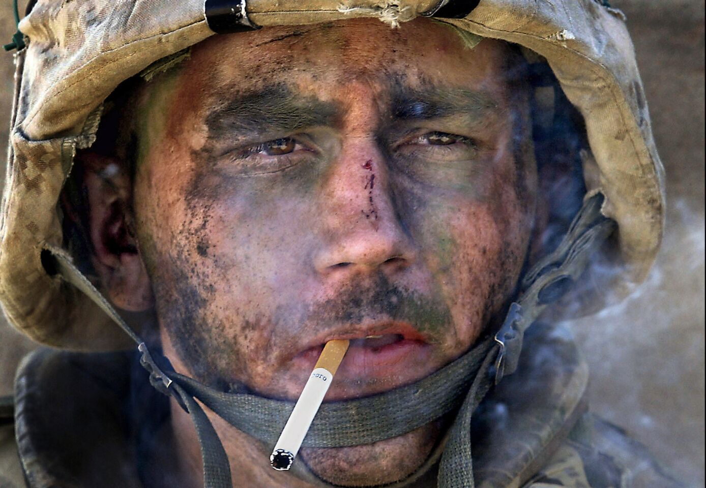 Finalist Luis Sinco of Los Angeles Times. For his iconic photograph of an exhausted U.S. Marine's face after a daylong battle in Iraq. I took this photograph of Lance Cpl. James Blake Miller on Nov. 9, 2004, while embedded with his Marine unit as they mounted an assault on the insurgent stronghold of Fallouja, Iraq. The image was published on the front pages of more than 150 newspapers and widely viewed on television and the internet. A country boy from Kentucky, Miller became an icon of the war. Many saw a heroic figure. In Miller's eyes I saw a man at the point of breaking. It was how I felt, too.