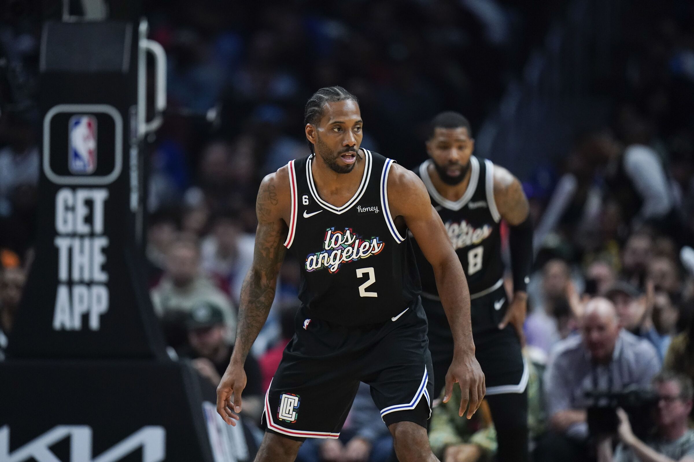 Clippers forward Kawhi Leonard gets into a defensive stance as the Raptors bring the ball up court.