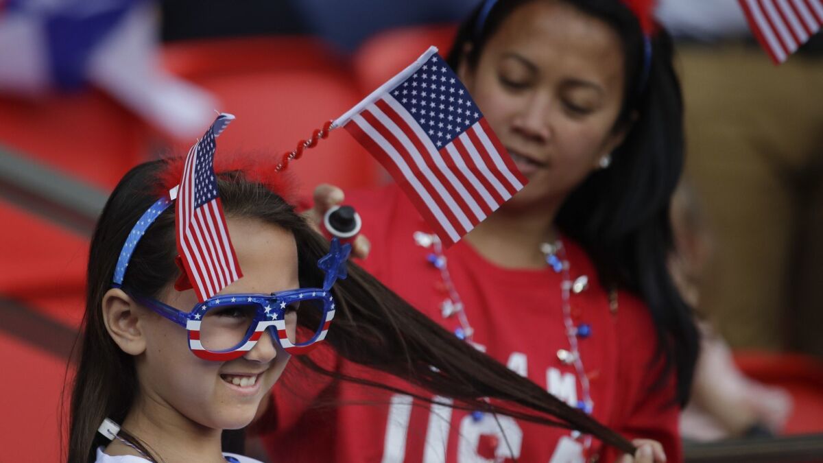 American fans wait for the start of the Women's World Cup game between United States and Chile on Sunday at Parc des Princes in Paris.