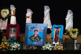 FILE - Ladies from the Queen of Peace Church walk to the stage to pray the rosary during the memorial service of U.S. Army Specialist Vanessa Guillén at the Cesar Chavez High School on Aug. 14, 2020, in Houston. A federal judge has sentenced a Texas woman Monday, Aug. 14, 2023, to 30 years in prison for helping to dispose of the body of U.S. soldier Guillén. The 2020 killing led to changes in how women in the military can report sexual abuse. (Marie D. De Jesus/Houston Chronicle via AP, Pool, File)