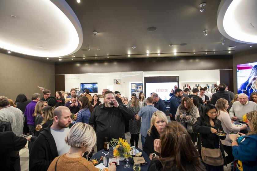 Guests participate in the Newport Beach Restaurant Week kickoff party at the Lincoln Experience Center at Fashion Island on Thursday, January 9.