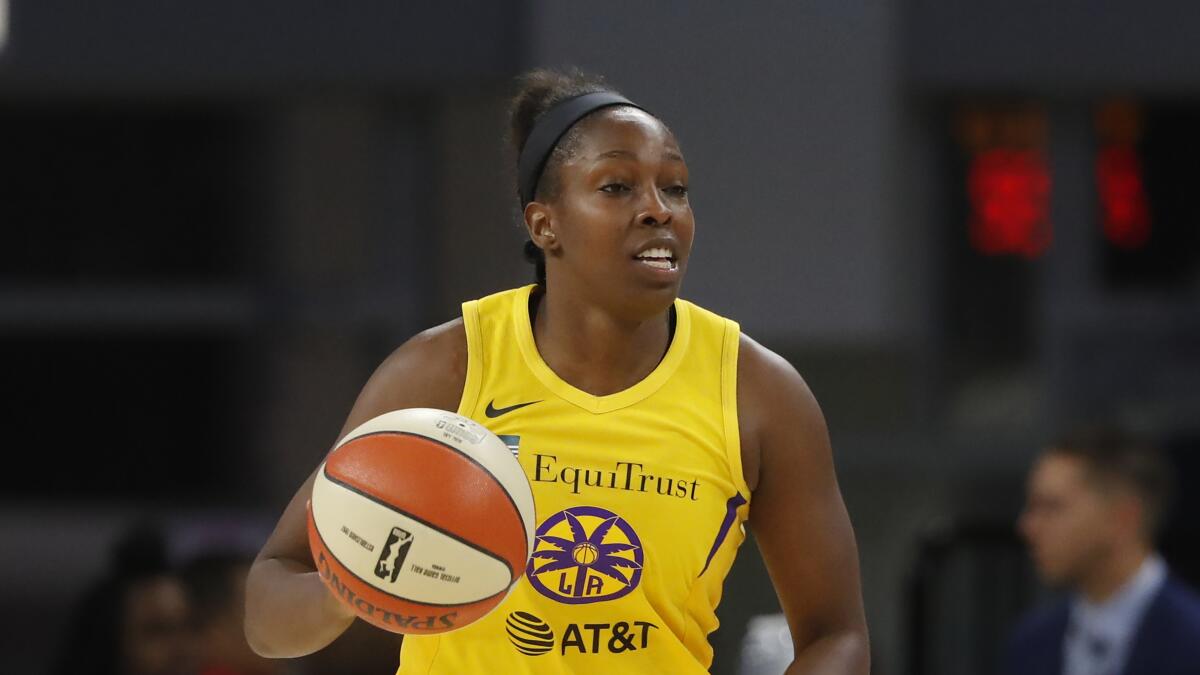 The Sparks' Chelsea Gray brings the ball up the court against the Sky on Aug. 16, 2019.