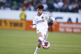 LA Galaxy midfielder Riqui Puig (6) passes the ball against the Seattle Sounders.