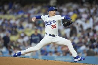 Los Angeles Dodgers pitcher Gavin Stone throws to a Los Angeles Dodgers batter.