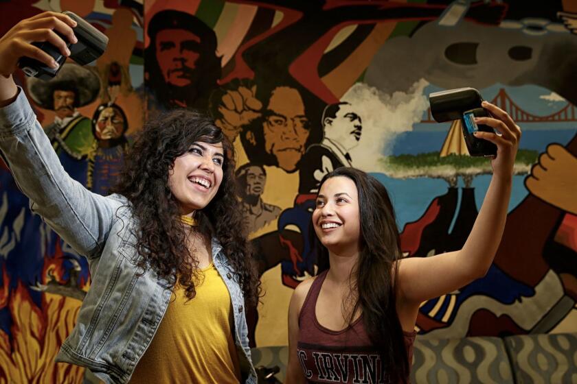 IRVINE, CA, WEDNESDAY, MAY 31, 2017 - UC Irvine students Angela Vera, left, and Daniela Estrada are part of the growing Latino student population at UCI, which recently won federal designation as an "Hispanic Serving Institution." (Robert Gauthier/Los Angeles Times)