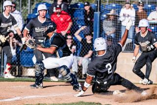 Ethan Price of Harvard-Westlake slides home with the winning run in the seventh of a 5-4 win over Sierra Canyon.
